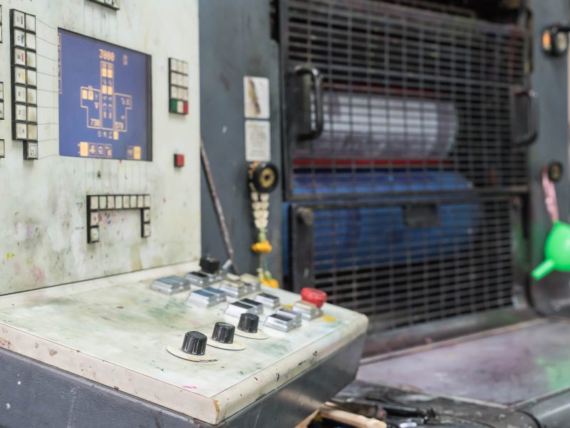 Old print finishing machine in printshop